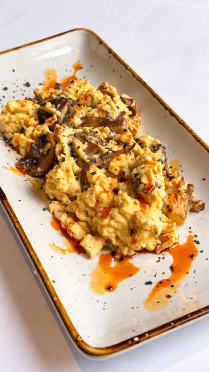 Scrambled eggs with mushrooms and chilli oil